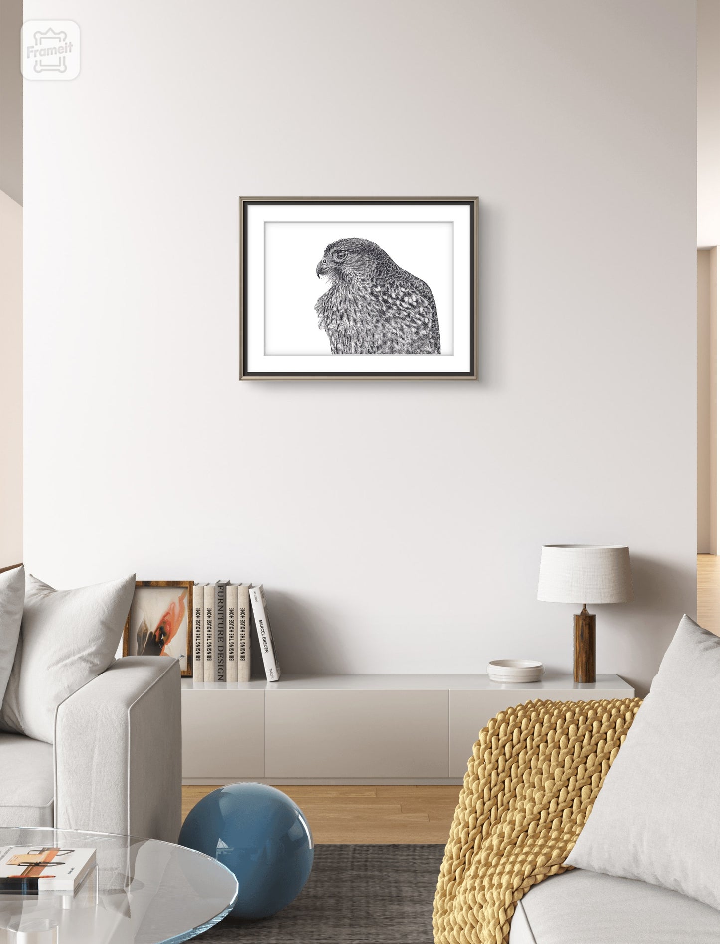 Maia NZ falcon graphite art print displayed in a calm interior setting
