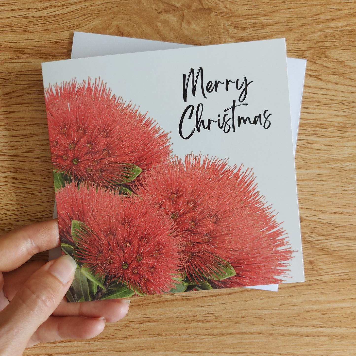 Christmas card featuring a coloured pencil illustration of a New Zealand pohutukawa